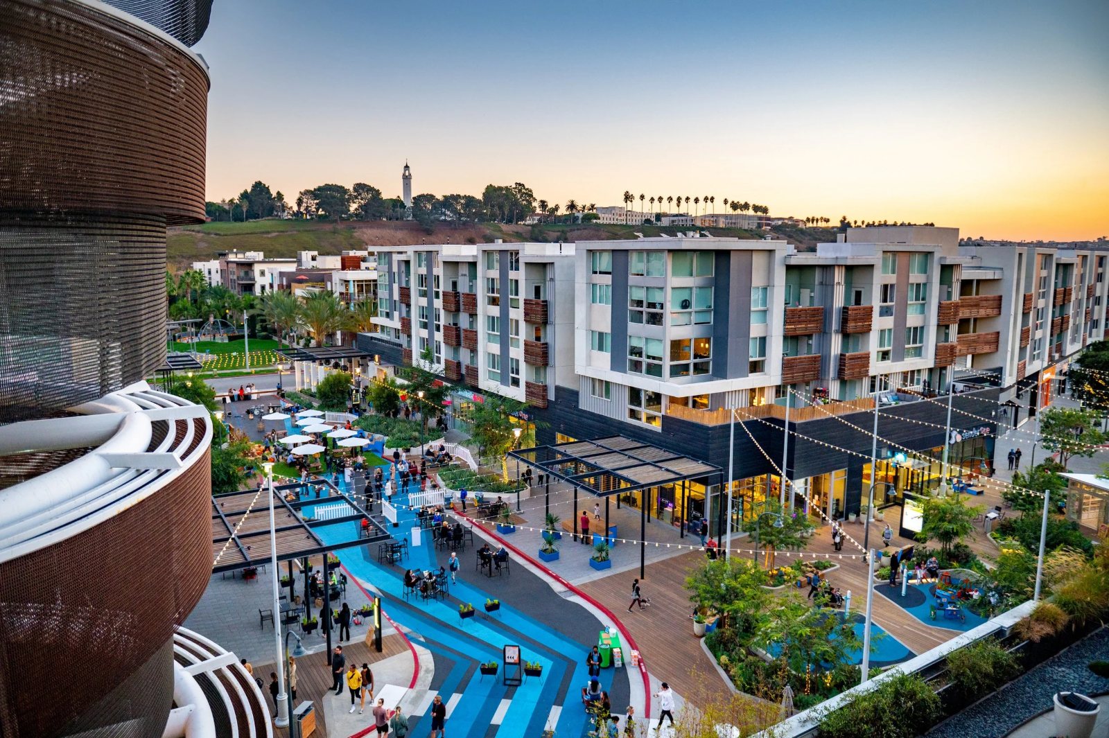 The Runway at Playa Vista at dusk, residences above the shops